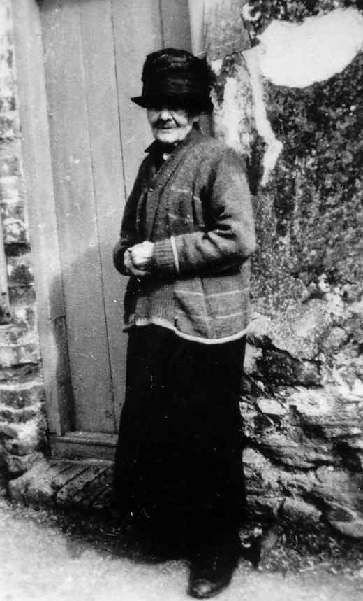 Mary Yarrow (née Gothard) outside her home in Little Thetford